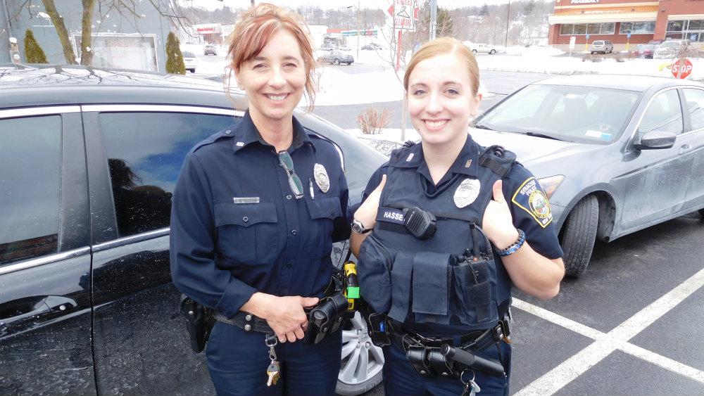 Syracuse Police Department Officer Carolyn Carbone, '93 (left) and her daughter Officer Sarah Hassett, '13 (right).