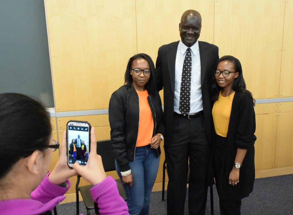 John Dau, '05 posed for a photo with OCC students. His book, "God Grew Tired of Us," is the subject of this year's common read.