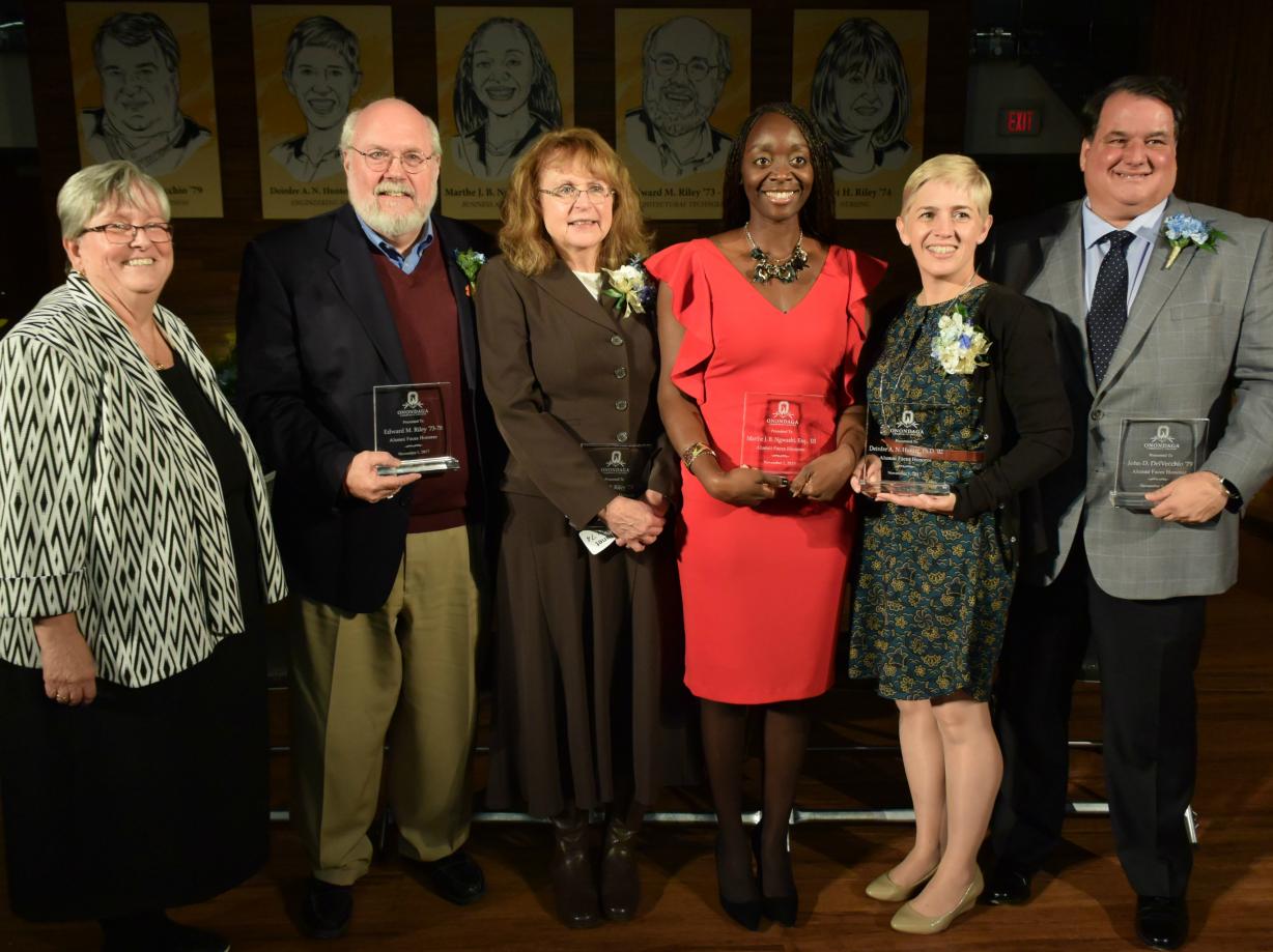 OCC President Casey Crabill with the 2017 class of Alumni Faces (left to right): Ed Riley, Janet Riley, Marthe Ngwashi, Deirdre Hunter and John DelVecchio.