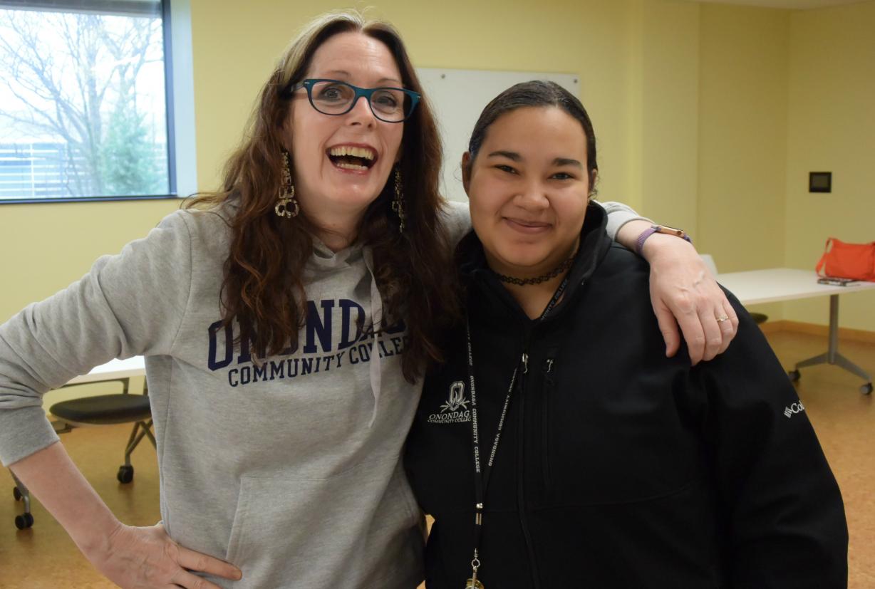 Best selling author and alumna Laurie Halse Anderson poses for a photo with student Samurai Johnson in the Community Room of Coulter Hall.