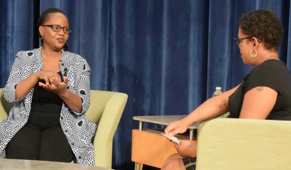 photo of Edwidge Danticat speaking with OCC student Kiki Horton. photo of Edwidge Danticat speaking with OCC student Kiki Horton.