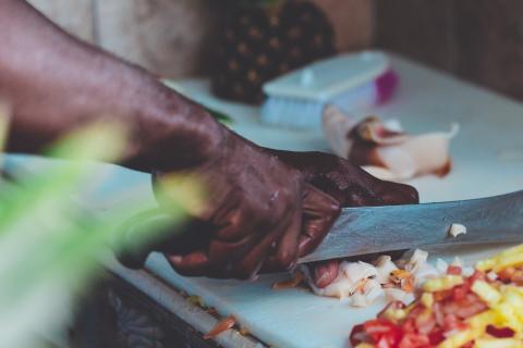 Man chopping vegetables