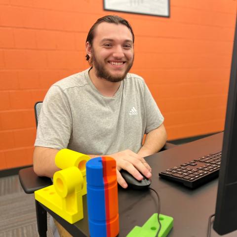 Curtis Taylor is a P-TECH student who is pursuing his Mechanical Technology degree while also working in the industry. He will graduate next May.