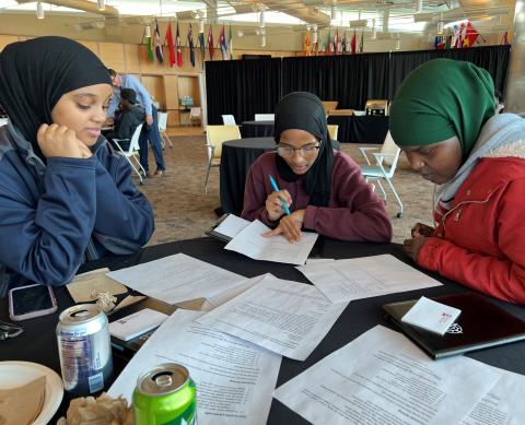 Onondaga Community College students (left to right) Hodan Ali, Istarlin Dafe, and Salado Mohamad discussed how to improve their writing skills during a workshop funded by the Robertson Endowment for Student Success in Writing.